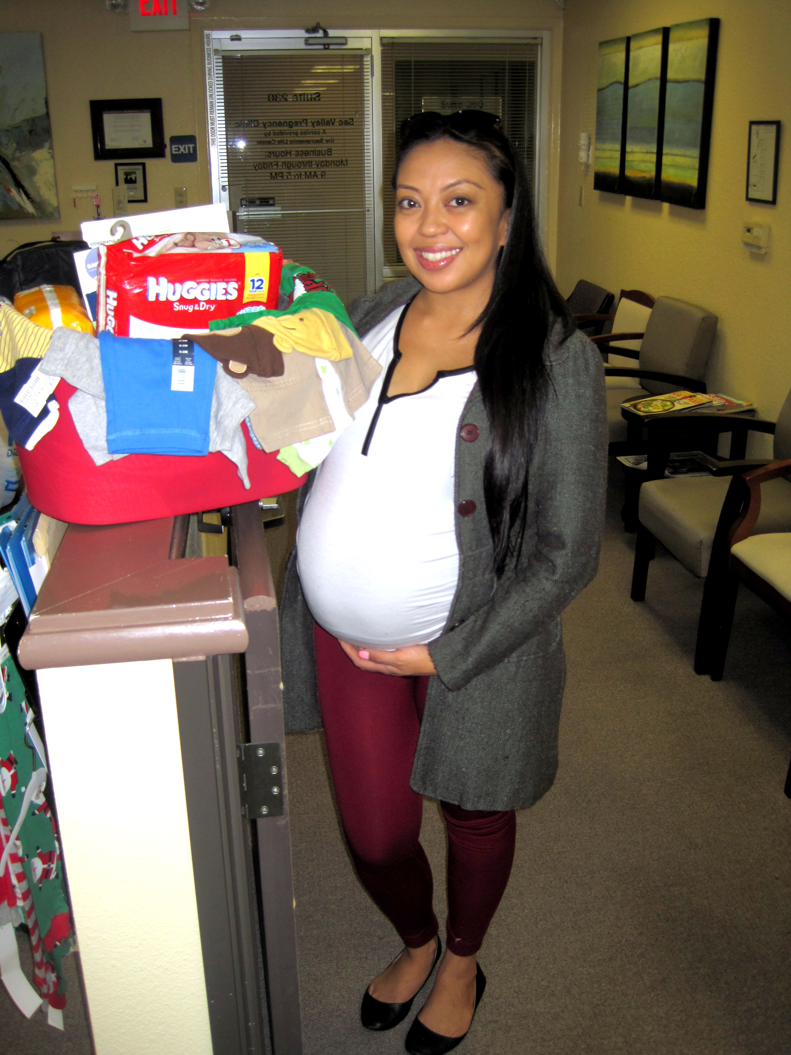 Sacramento Life Center client receives a baby basket donated by the community.