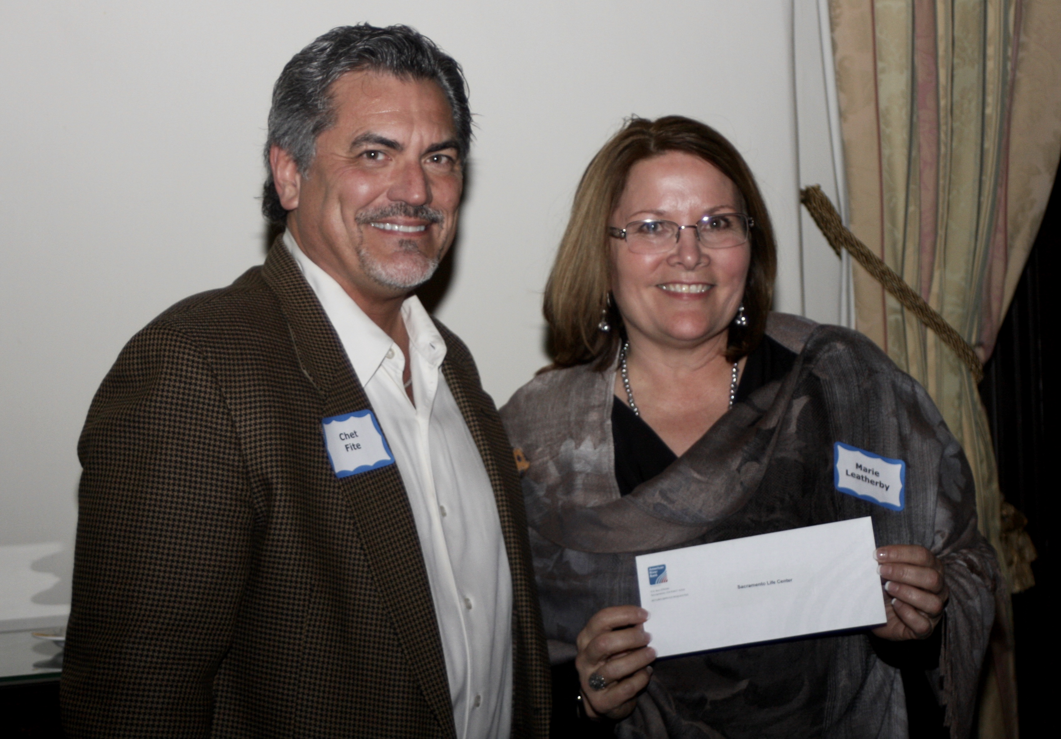 Sac Life Center receives check from American River Bank