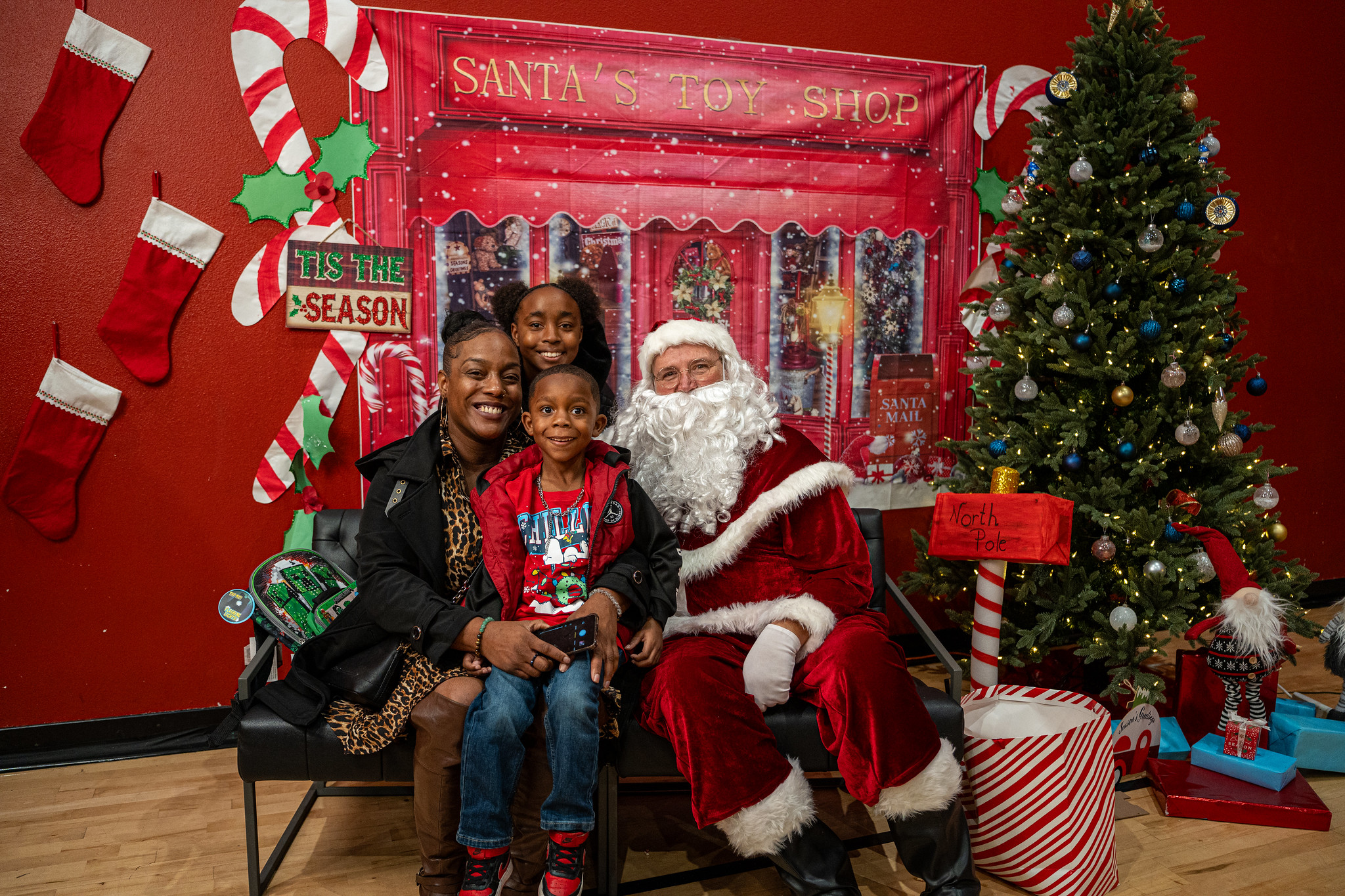 A local family has their picture taken with Santa Claus at the CBS13 and KMAX Season of Giving Holiday Market with United Way California Capital Region last year