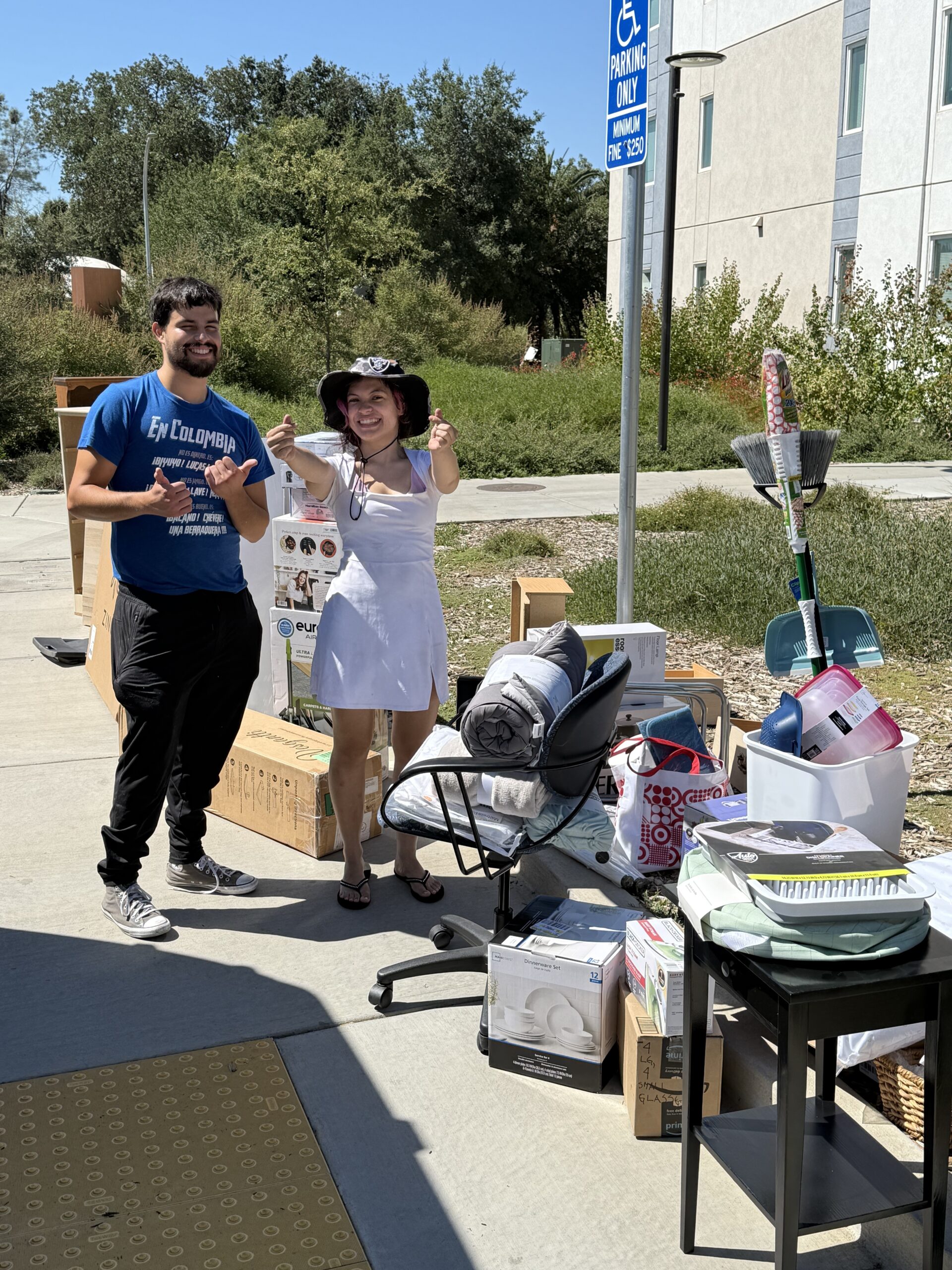 Two local youth unload the furniture and household goods they received from Make It Happen for Yolo County in fall 2025